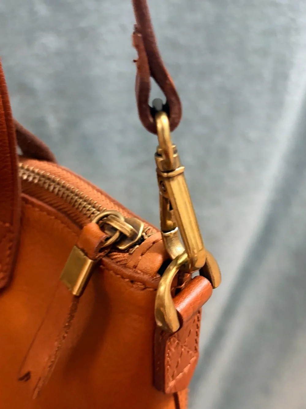 Madewell The Zip-Top Transport Crossbody Bag in English Saddle Leather.